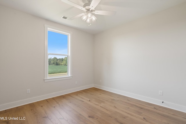 unfurnished room featuring light hardwood / wood-style floors and ceiling fan