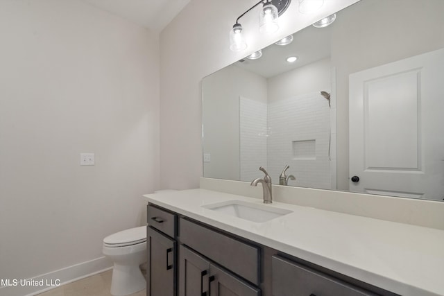 bathroom with vanity, a shower, toilet, and tile patterned flooring