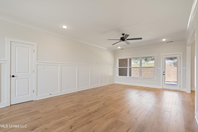 unfurnished room with crown molding, light wood-type flooring, and ceiling fan