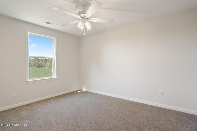 empty room with carpet floors and ceiling fan