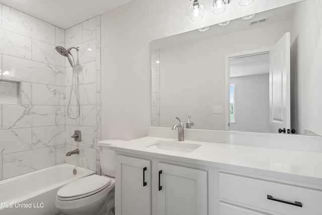 full bathroom with vanity, toilet, and tiled shower / bath