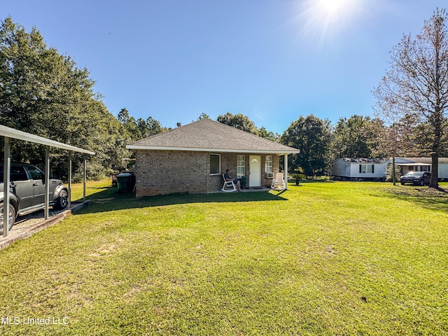 view of yard with a carport