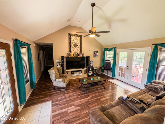 living room with french doors, ceiling fan, hardwood / wood-style flooring, and vaulted ceiling