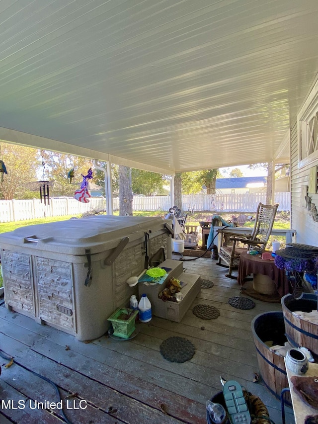 view of patio with a hot tub and a wooden deck