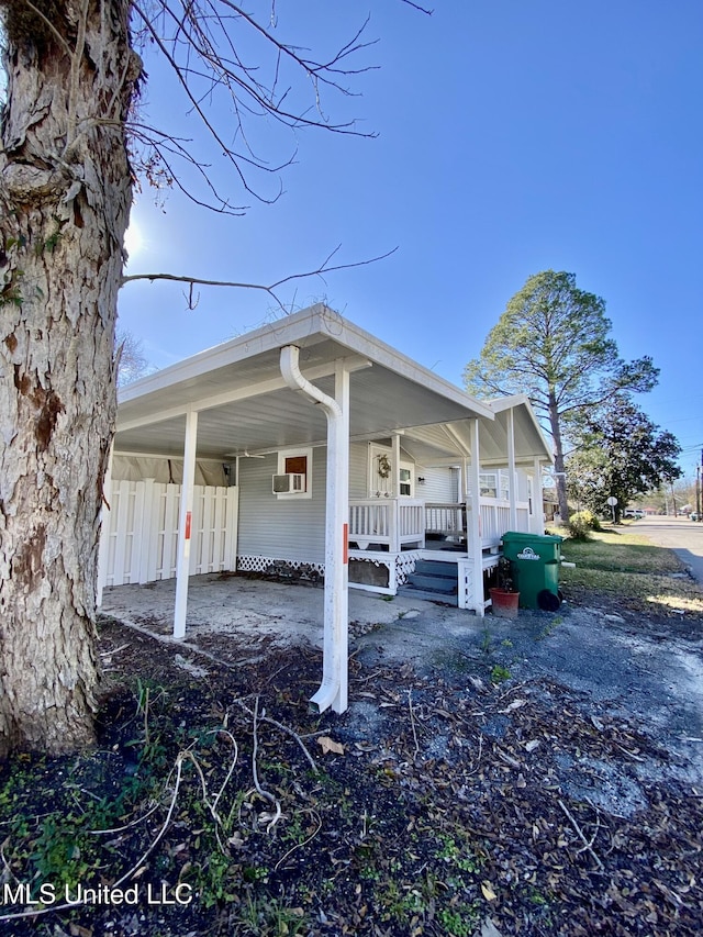 view of property exterior featuring a porch