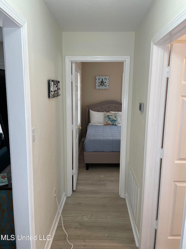 hall with light wood-type flooring