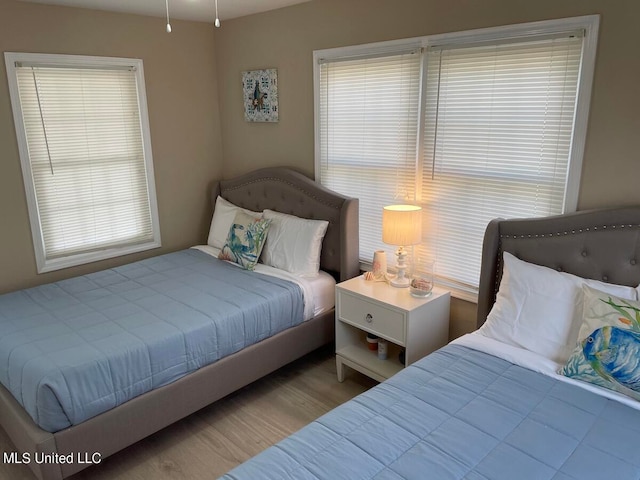 bedroom featuring light wood-type flooring