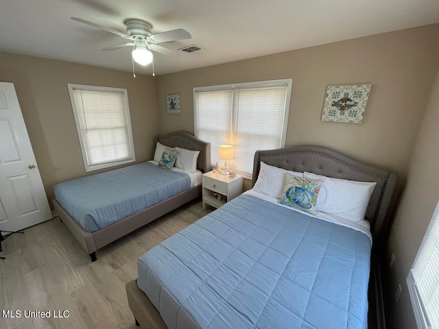 bedroom featuring light hardwood / wood-style flooring and ceiling fan