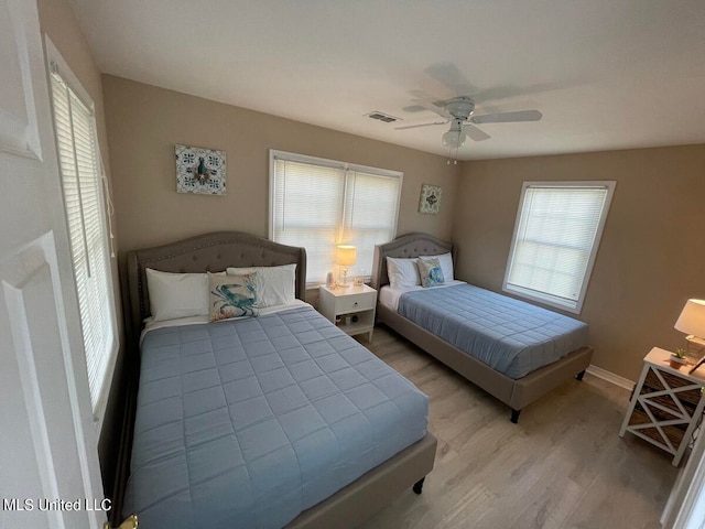 bedroom with ceiling fan and light hardwood / wood-style flooring