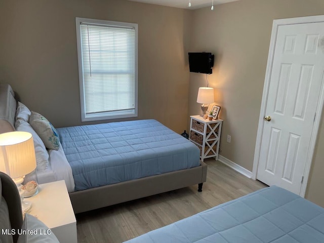 bedroom featuring light hardwood / wood-style floors