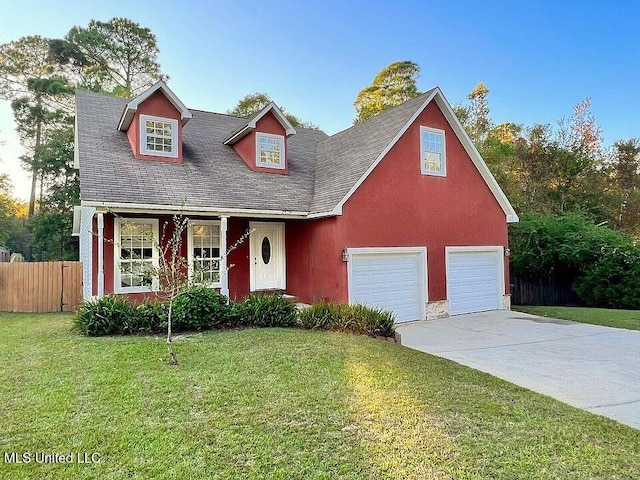 view of front of home featuring stucco siding, a front lawn, fence, concrete driveway, and a garage