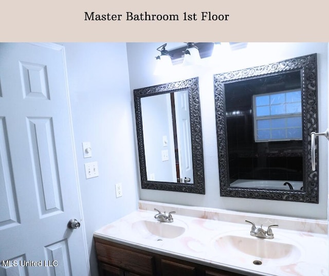 bathroom featuring double vanity and a sink