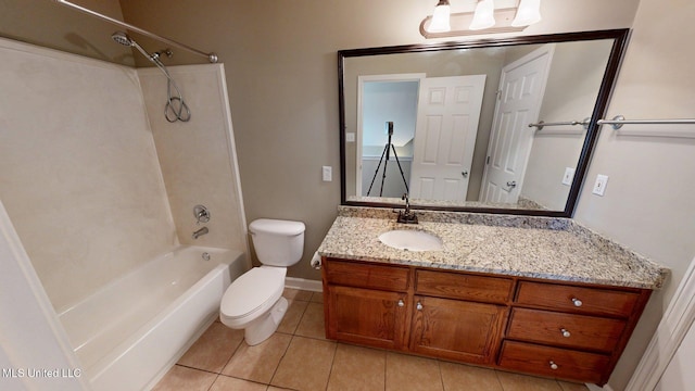 full bath featuring toilet, bathtub / shower combination, baseboards, tile patterned flooring, and vanity