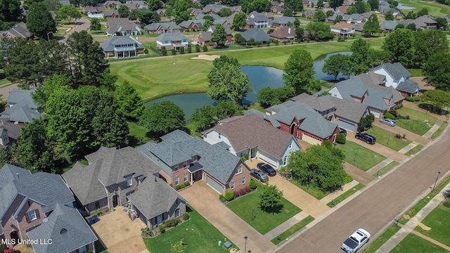birds eye view of property with a water view, golf course view, and a residential view
