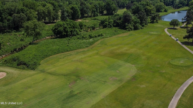 bird's eye view with a water view and golf course view