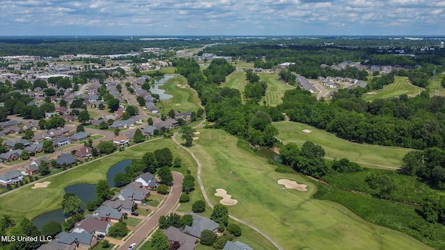 birds eye view of property with a water view, golf course view, and a residential view