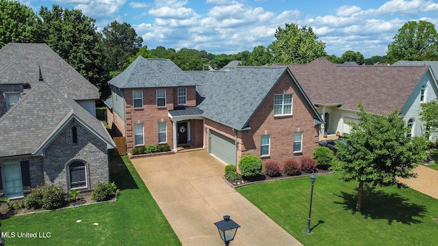 view of front of house with brick siding, driveway, a front yard, a garage, and roof with shingles