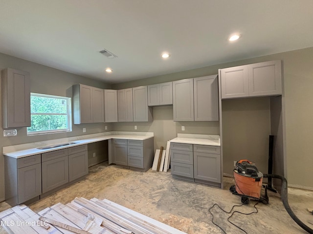 kitchen with sink and gray cabinetry