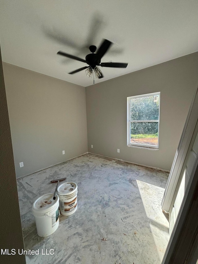 spare room with ceiling fan