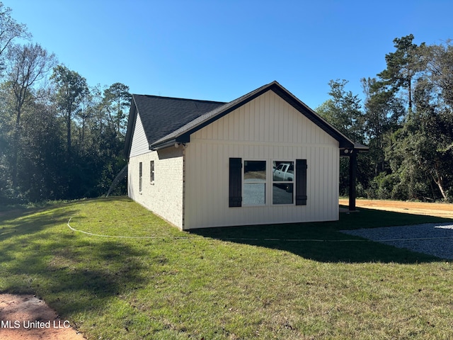 view of property exterior featuring a lawn