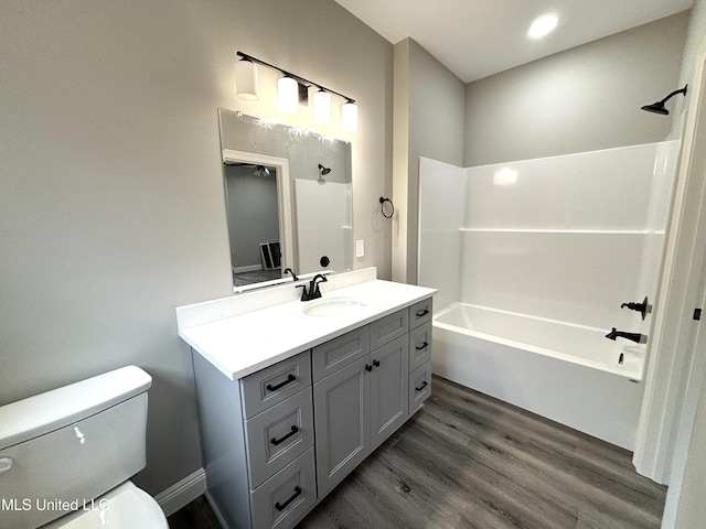 full bathroom with toilet, vanity, bathtub / shower combination, and wood-type flooring