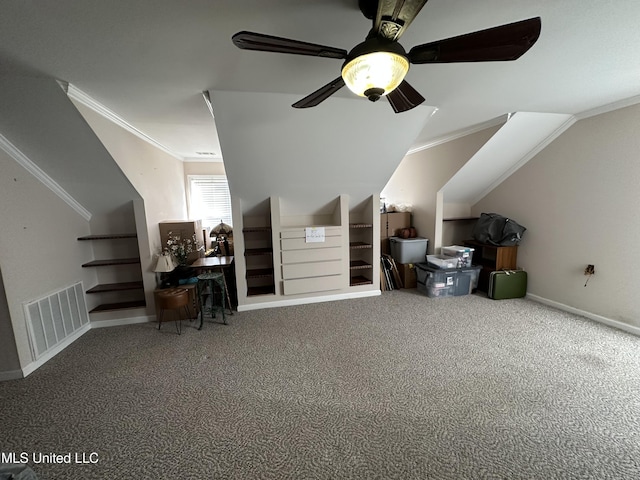 additional living space with carpet, visible vents, a ceiling fan, vaulted ceiling, and baseboards