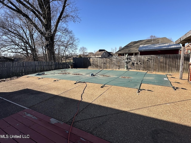 view of swimming pool with a fenced in pool, a patio area, and fence