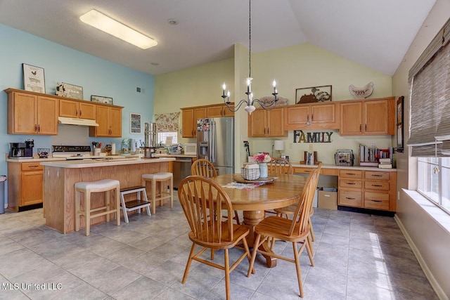 dining space featuring high vaulted ceiling, baseboards, a chandelier, and visible vents