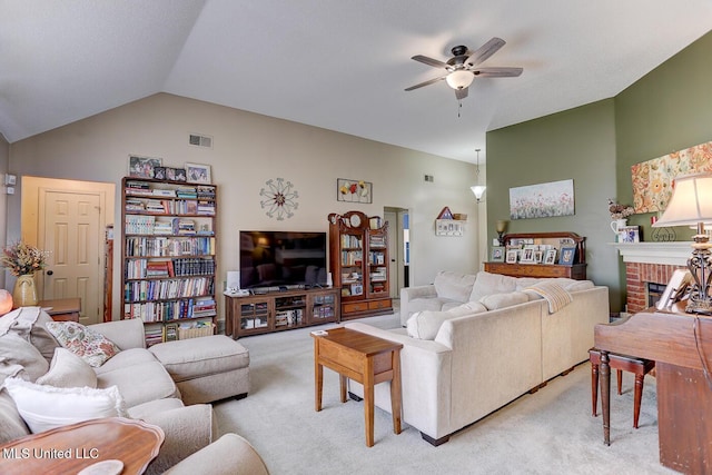 living area with lofted ceiling, visible vents, light carpet, and ceiling fan