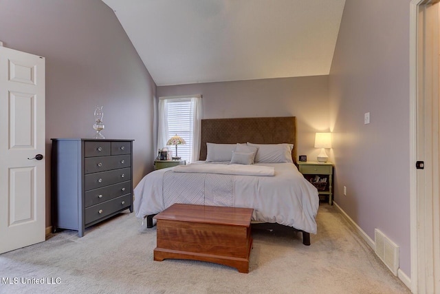 bedroom featuring lofted ceiling, light carpet, baseboards, and visible vents