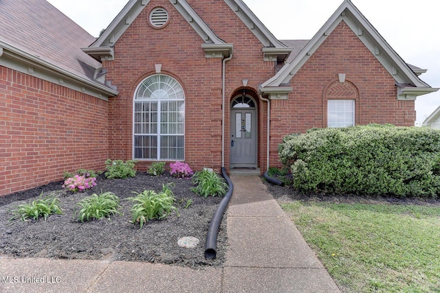 view of front of home with brick siding