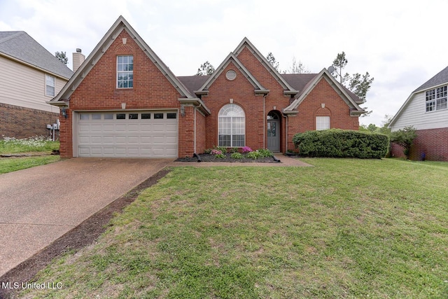 view of front of property featuring an attached garage, brick siding, a front yard, and concrete driveway