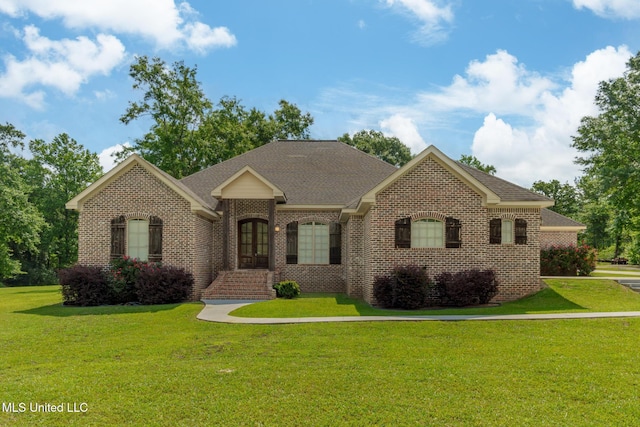 48 Harrell Rd, Hattiesburg, MS 39401 - view of front facade featuring brick siding, a front yard, and a shingled roof