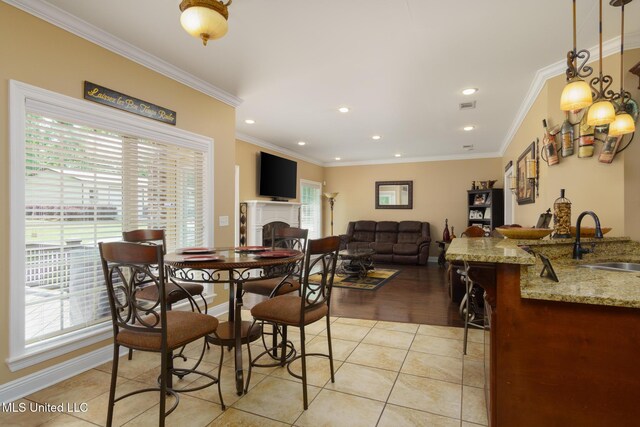 48 Harrell Rd, Hattiesburg, MS 39401 - dining room with plenty of natural light, a fireplace, ornamental molding, baseboards, and recessed lighting