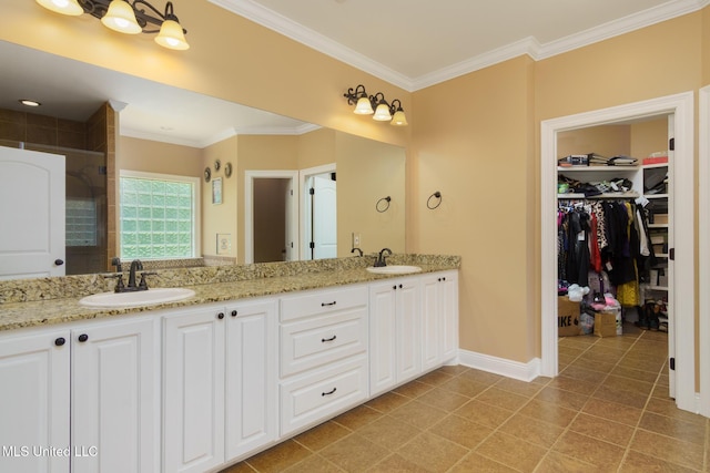 48 Harrell Rd, Hattiesburg, MS 39401 - full bathroom featuring baseboards, double vanity, a spacious closet, crown molding, and a stall shower