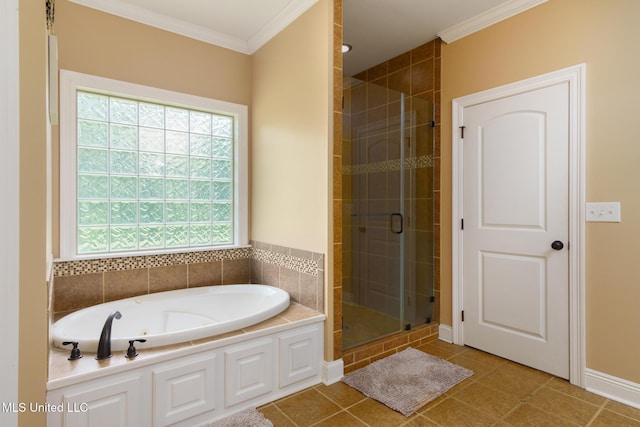 48 Harrell Rd, Hattiesburg, MS 39401 - bathroom with crown molding, a shower stall, a garden tub, tile patterned floors, and baseboards
