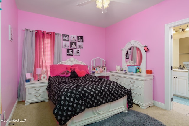 48 Harrell Rd, Hattiesburg, MS 39401 - bedroom featuring light carpet, a sink, connected bathroom, baseboards, and a ceiling fan
