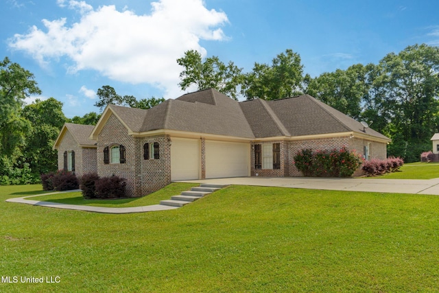 48 Harrell Rd, Hattiesburg, MS 39401 - view of front of house featuring brick siding, an attached garage, a front lawn, and concrete driveway
