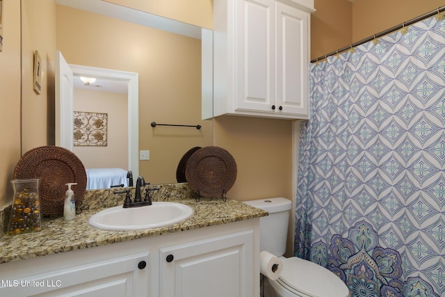 48 Harrell Rd, Hattiesburg, MS 39401 - bathroom with toilet, vanity, and curtained shower