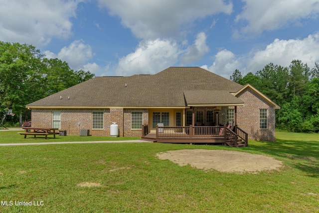 48 Harrell Rd, Hattiesburg, MS 39401 - back of property with brick siding, a wooden deck, a yard, central air condition unit, and roof with shingles
