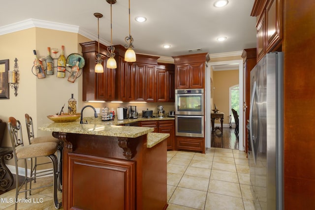 48 Harrell Rd, Hattiesburg, MS 39401 - kitchen featuring stainless steel appliances, a peninsula, ornamental molding, light tile patterned floors, and pendant lighting