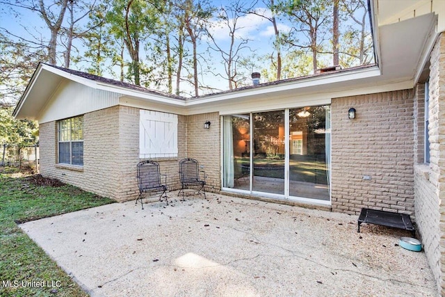 back of property with a patio area