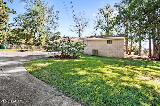 view of yard with central AC