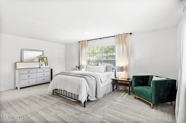 bedroom featuring light carpet