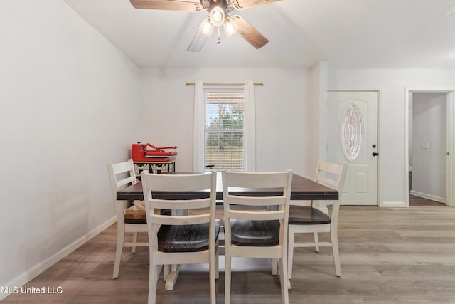 dining space featuring ceiling fan and light wood-type flooring