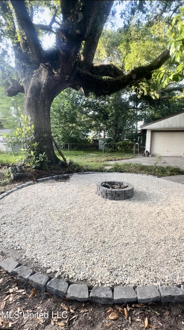 809 Herrick Ave, Pascagoula, MS 39567 - view of property's community featuring an outdoor fire pit and a garage