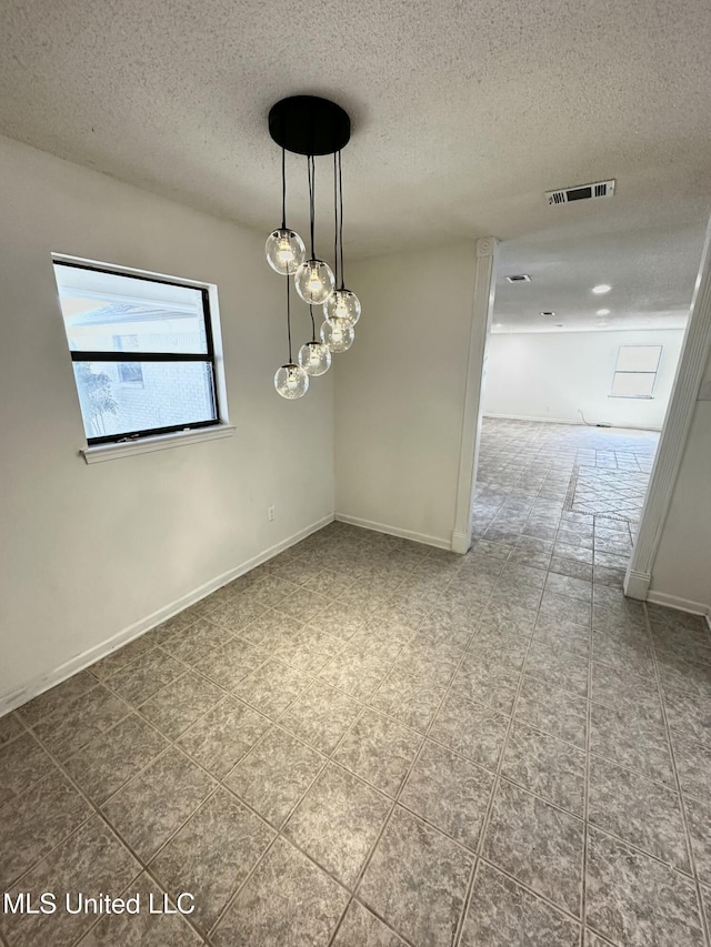 809 Herrick Ave, Pascagoula, MS 39567 - spare room with a textured ceiling