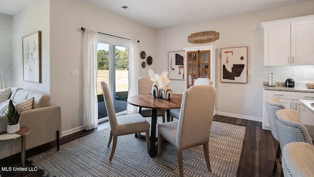 57 Silo Ln, Byhalia, MS 38611 - dining area with dark wood-style floors and baseboards