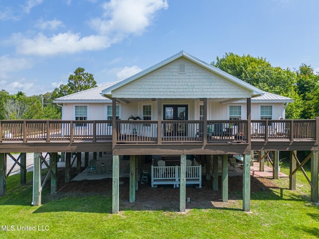129 Marcie Dr, Long Beach, MS 39560 - rear view of property with a wooden deck, a lawn, metal roof, and a carport