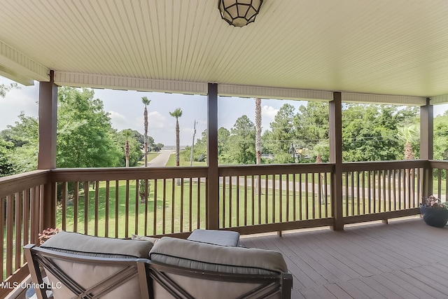 129 Marcie Dr, Long Beach, MS 39560 - wooden deck with a yard and view of scattered trees